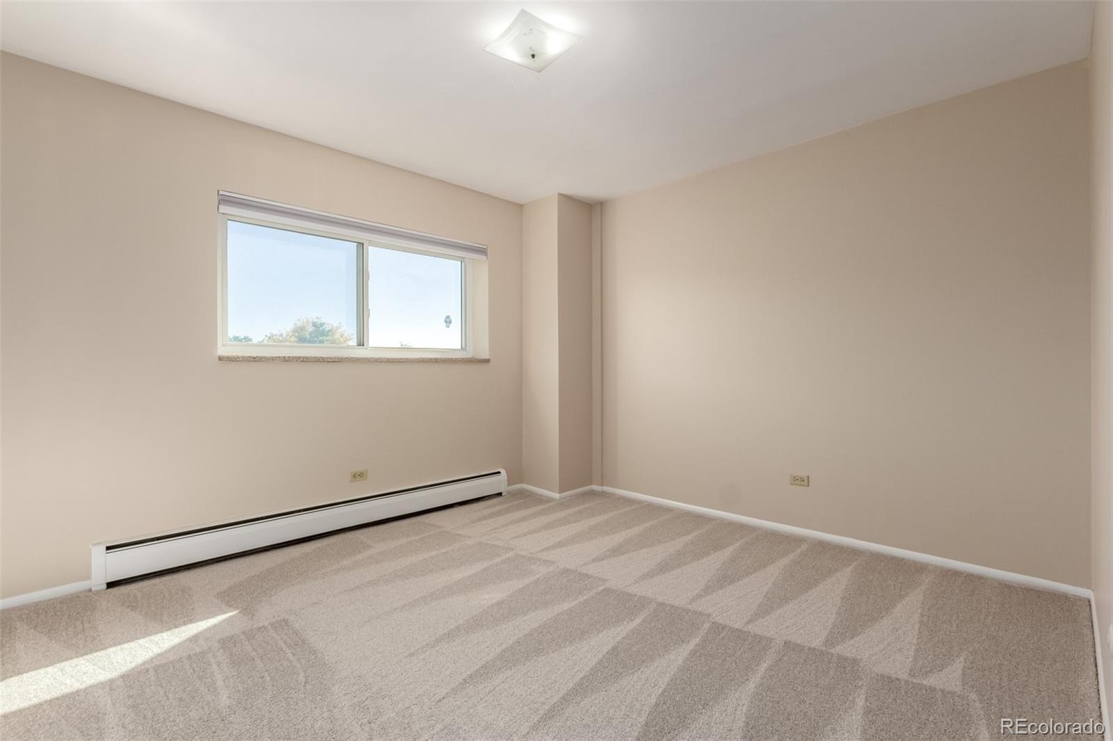 830 20th Street, Unit 206 Boulder, CO 80302 - Photo 18 of 27 a view of an empty room with a window