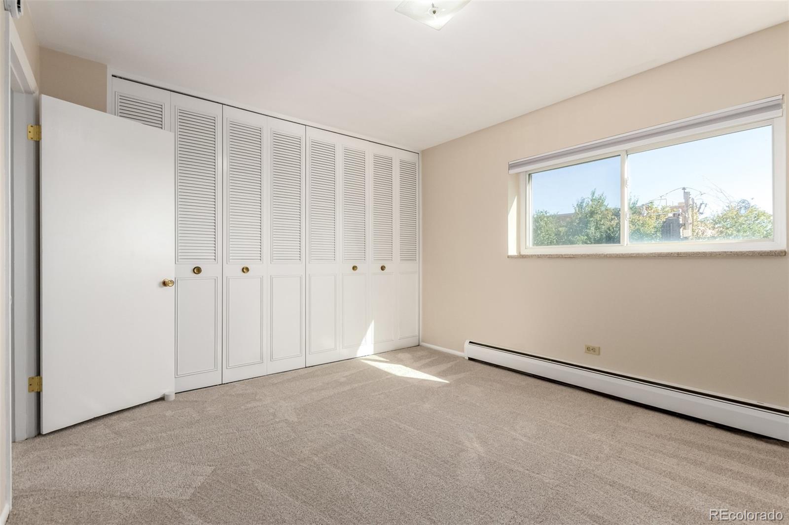830 20th Street, Unit 206 Boulder, CO 80302 - Photo 20 of 27 a view of an empty room with a window