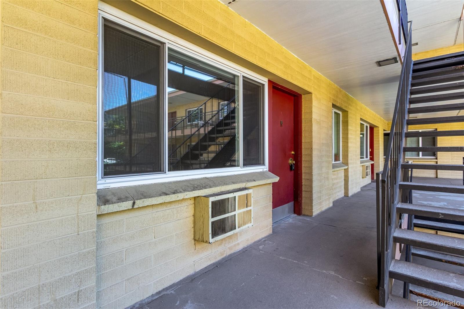830 20th Street, Unit 206 Boulder, CO 80302 - Photo 2 of 27 a view of an empty room with wooden floor and windows