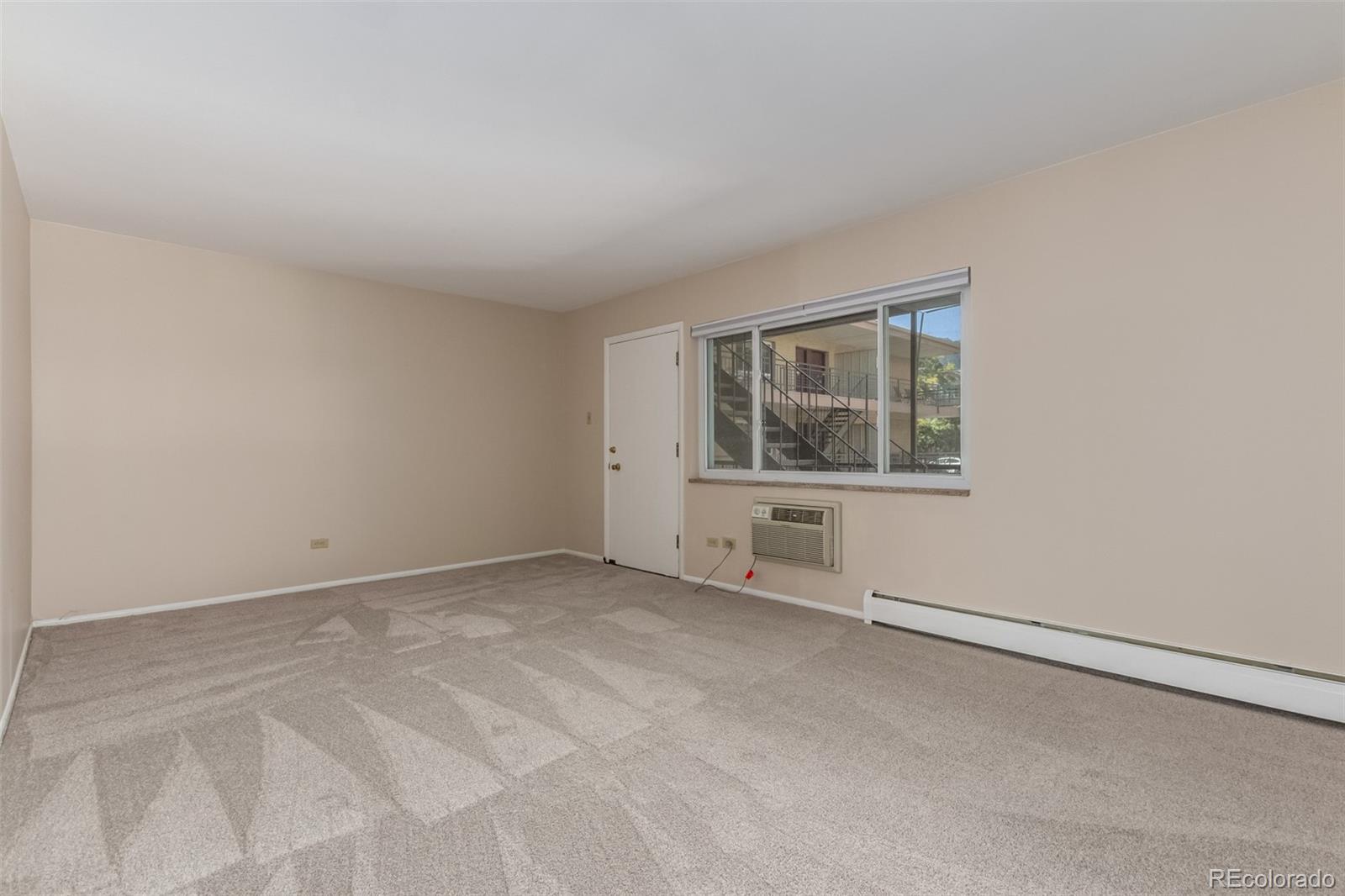 830 20th Street, Unit 206 Boulder, CO 80302 - Photo 6 of 27 an empty room with a empty space and windows