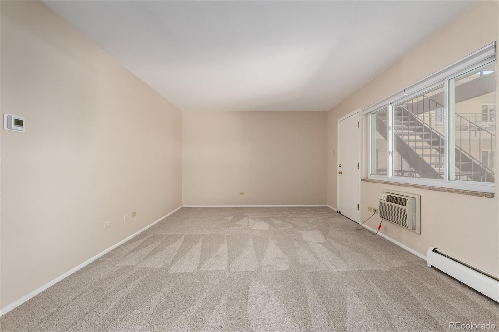 830 20th Street, Unit 206 Boulder, CO 80302 - Photo 9 of 27 an empty room with windows