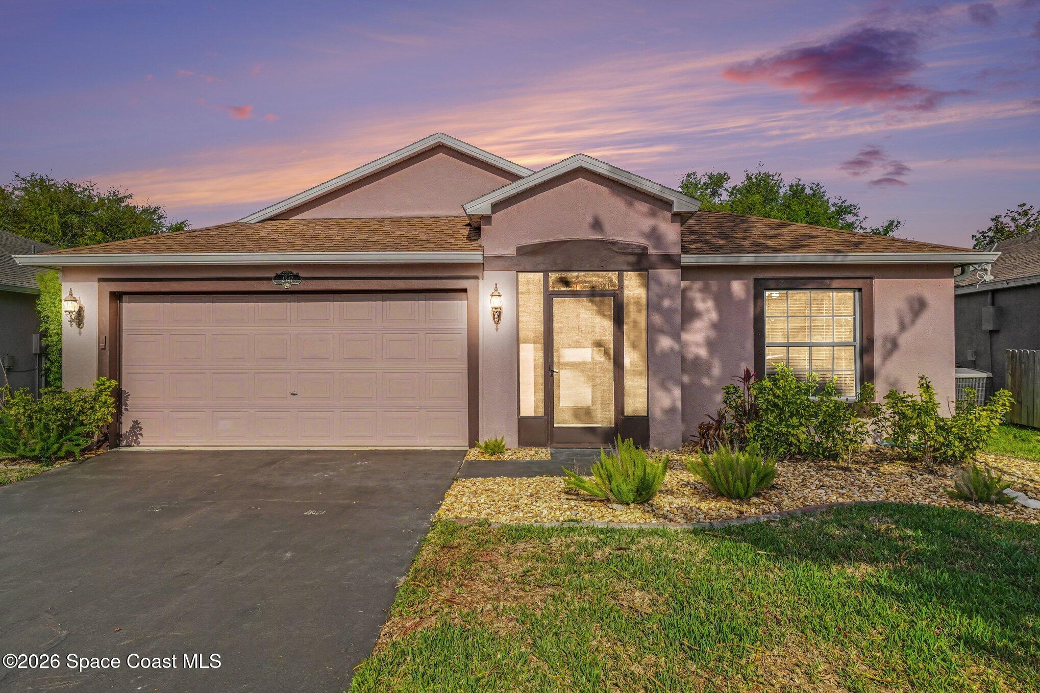 2547 Deercroft Drive Melbourne, FL 32940 - Photo 1 of 35 front view of a house with a yard