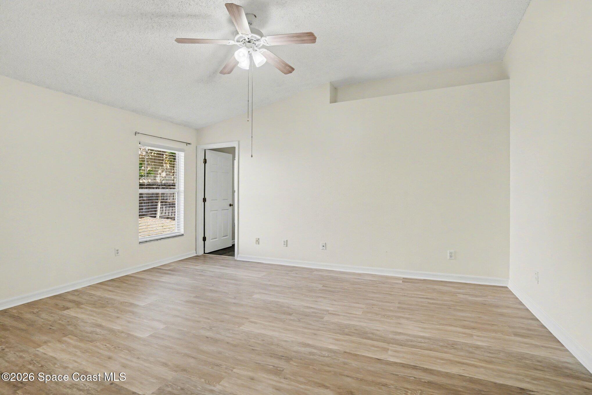 2547 Deercroft Drive Melbourne, FL 32940 - Photo 14 of 35 wooden floor in an empty room