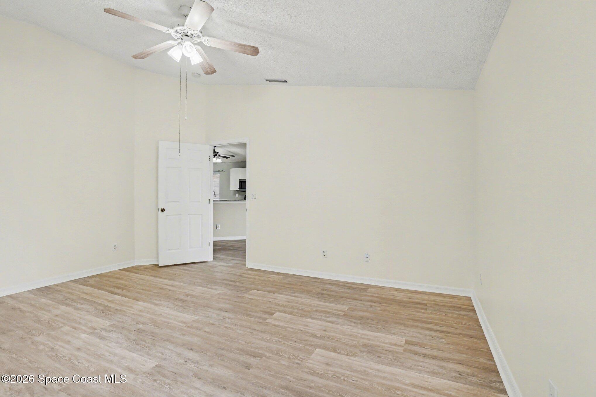 2547 Deercroft Drive Melbourne, FL 32940 - Photo 16 of 35 wooden floor in an empty room
