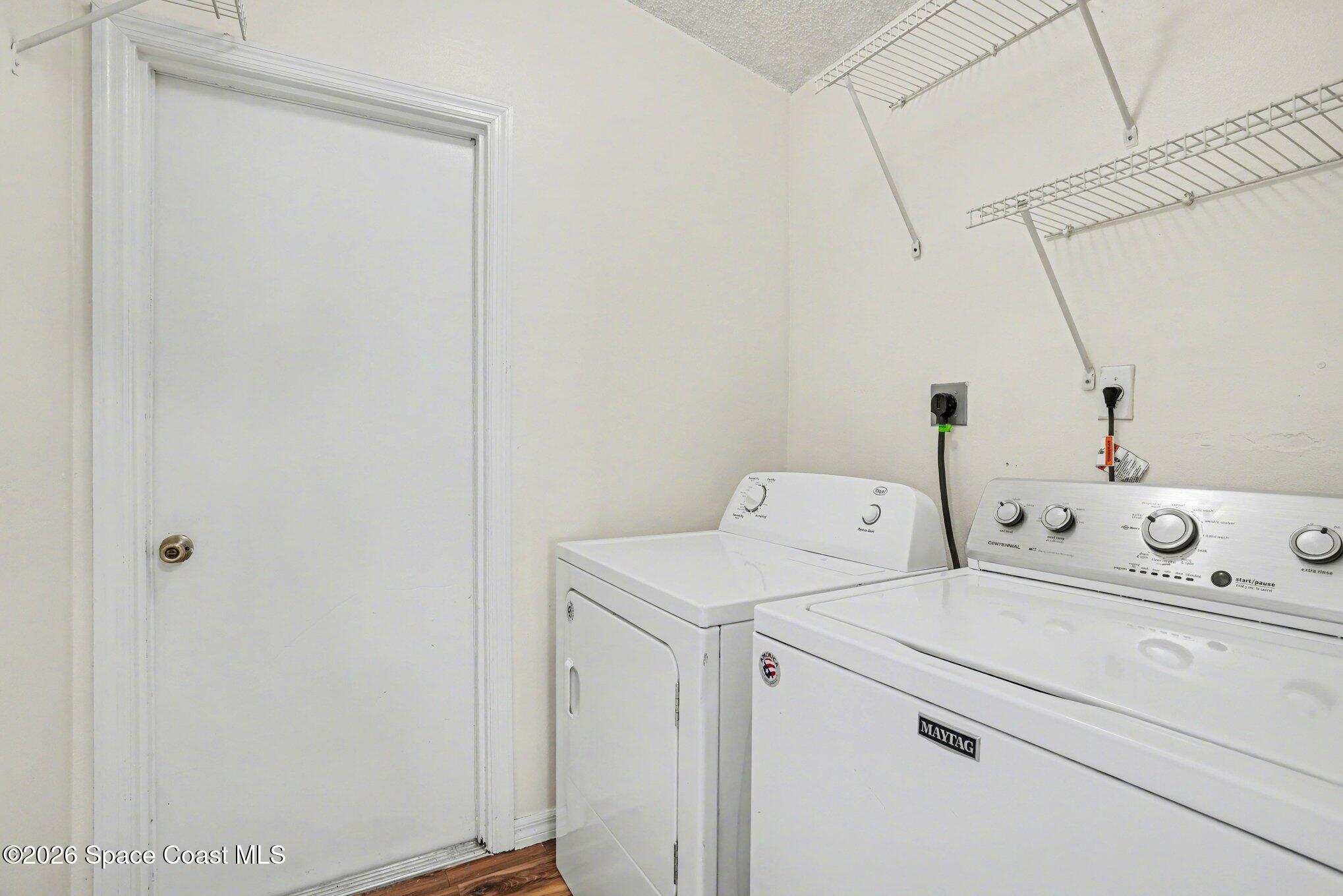 2547 Deercroft Drive Melbourne, FL 32940 - Photo 27 of 35 a utility room with dryer and washer