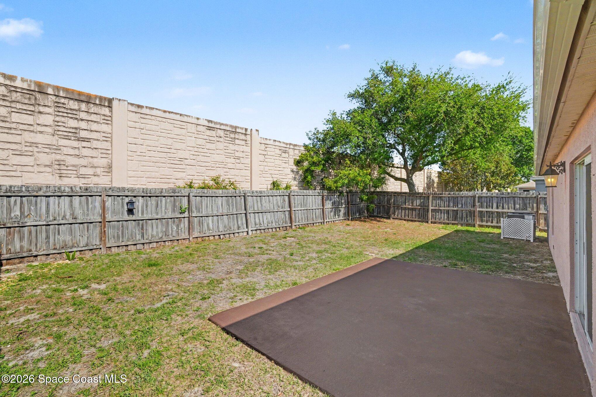 2547 Deercroft Drive Melbourne, FL 32940 - Photo 29 of 35 a view of backyard with wooden fence
