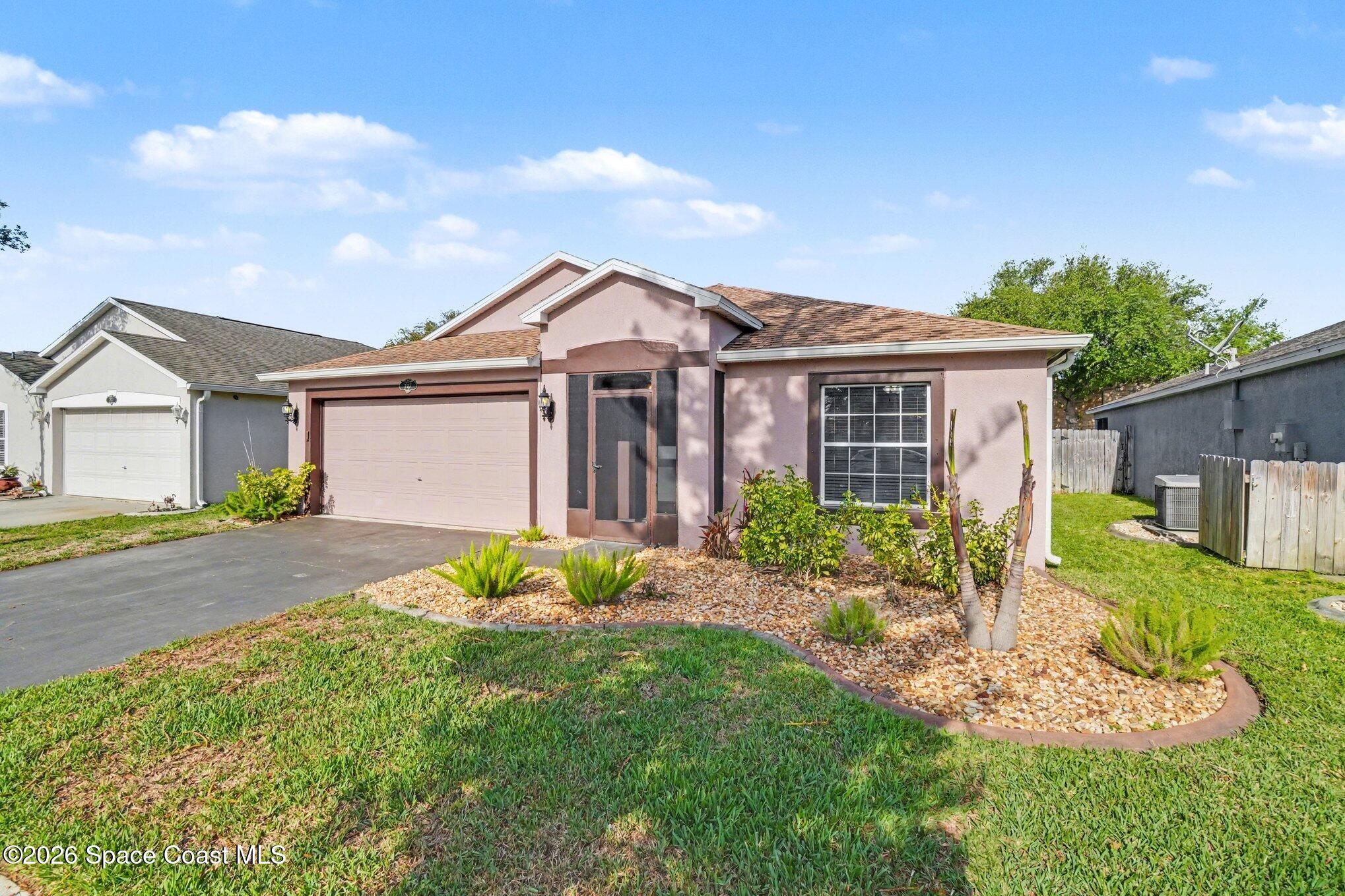 2547 Deercroft Drive Melbourne, FL 32940 - Photo 3 of 35 front view of a house with a yard