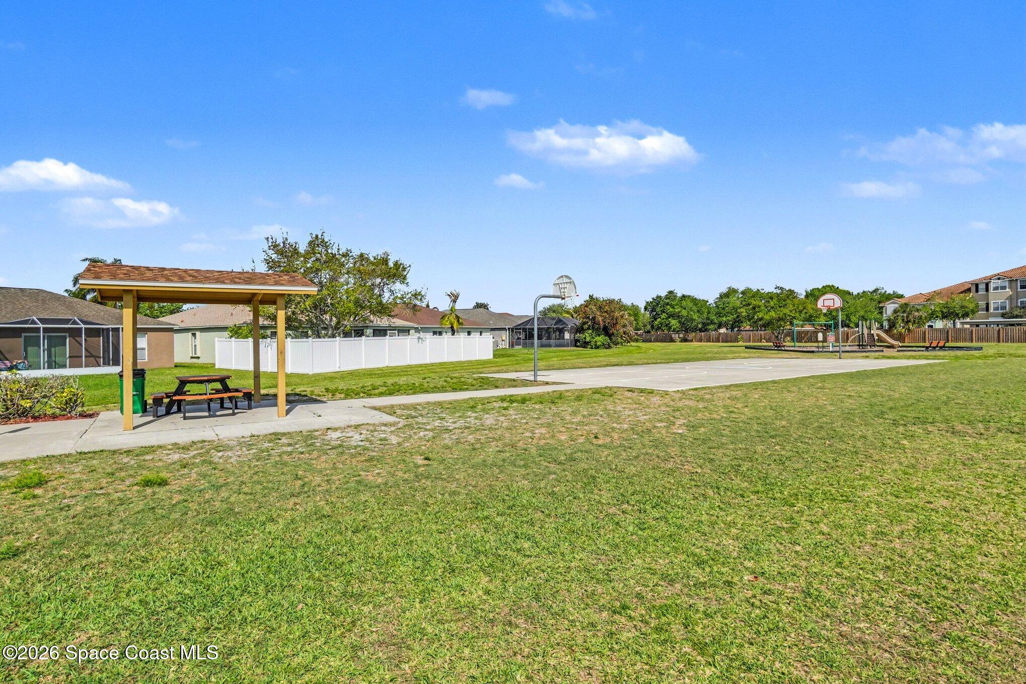 2547 Deercroft Drive Melbourne, FL 32940 - Photo 31 of 35 a view of a swimming pool and a yard