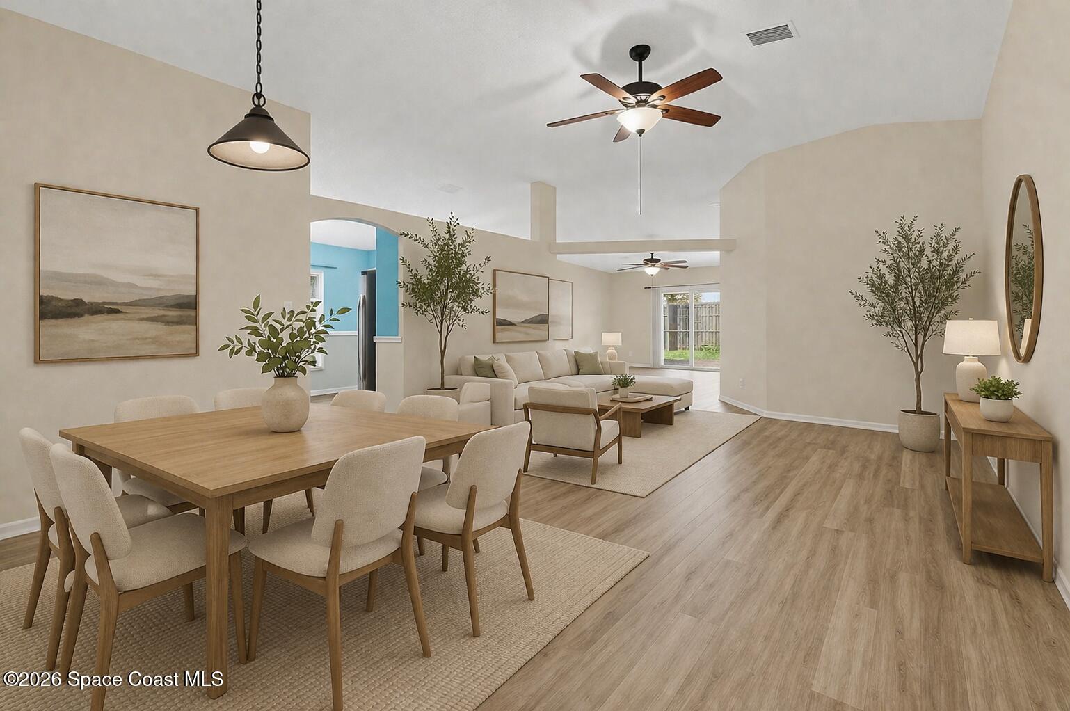 2547 Deercroft Drive Melbourne, FL 32940 - Photo 5 of 35 a view of a livingroom and dining room with furniture wooden floor a chandelier