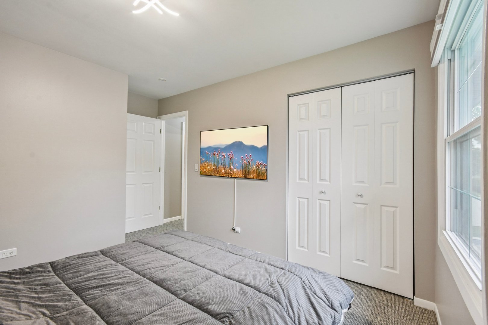 1860 Burr Ridge Drive Hoffman Estates, IL 60192 - Photo 14 of 34 a bedroom with a bed and a window