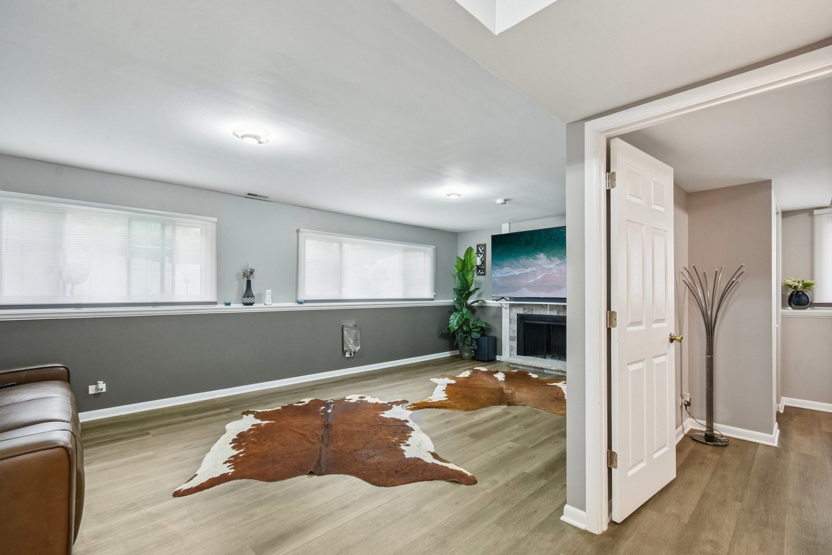 1860 Burr Ridge Drive Hoffman Estates, IL 60192 - Photo 18 of 34 a view of a livingroom with wooden floor fireplace and windows