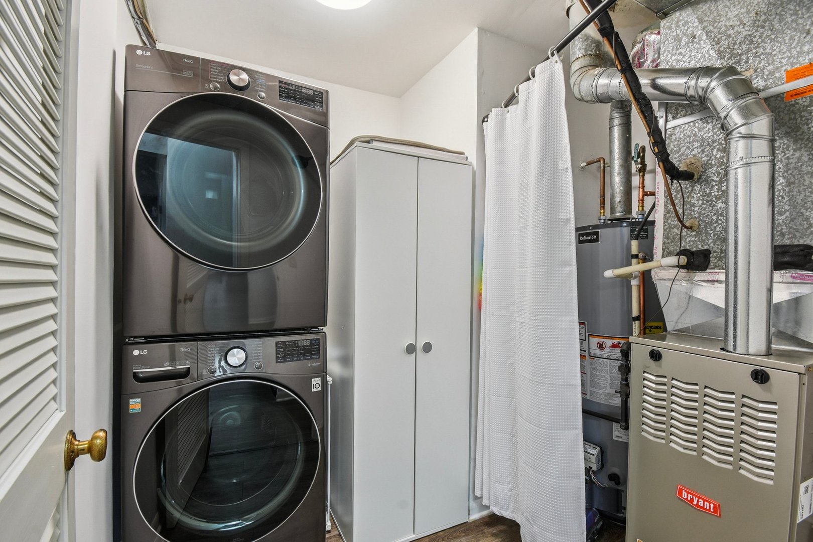 1860 Burr Ridge Drive Hoffman Estates, IL 60192 - Photo 24 of 34 a close view of a utility room with dryer and washer