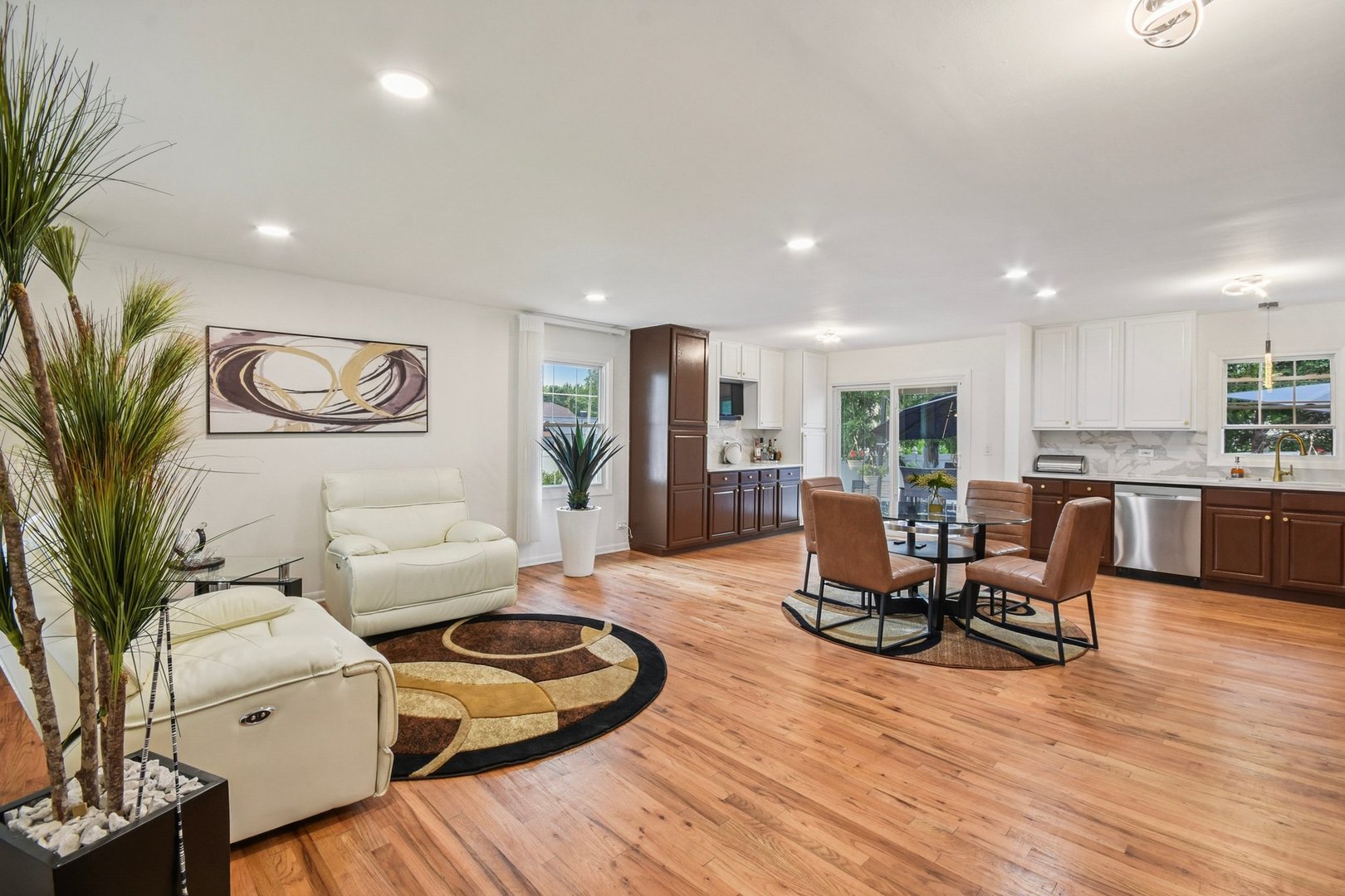 1860 Burr Ridge Drive Hoffman Estates, IL 60192 - Photo 4 of 34 a living room with furniture kitchen view and a wooden floor