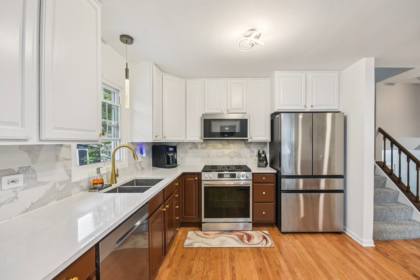 1860 Burr Ridge Drive Hoffman Estates, IL 60192 - Photo 7 of 34 a kitchen with stainless steel appliances a refrigerator sink and microwave