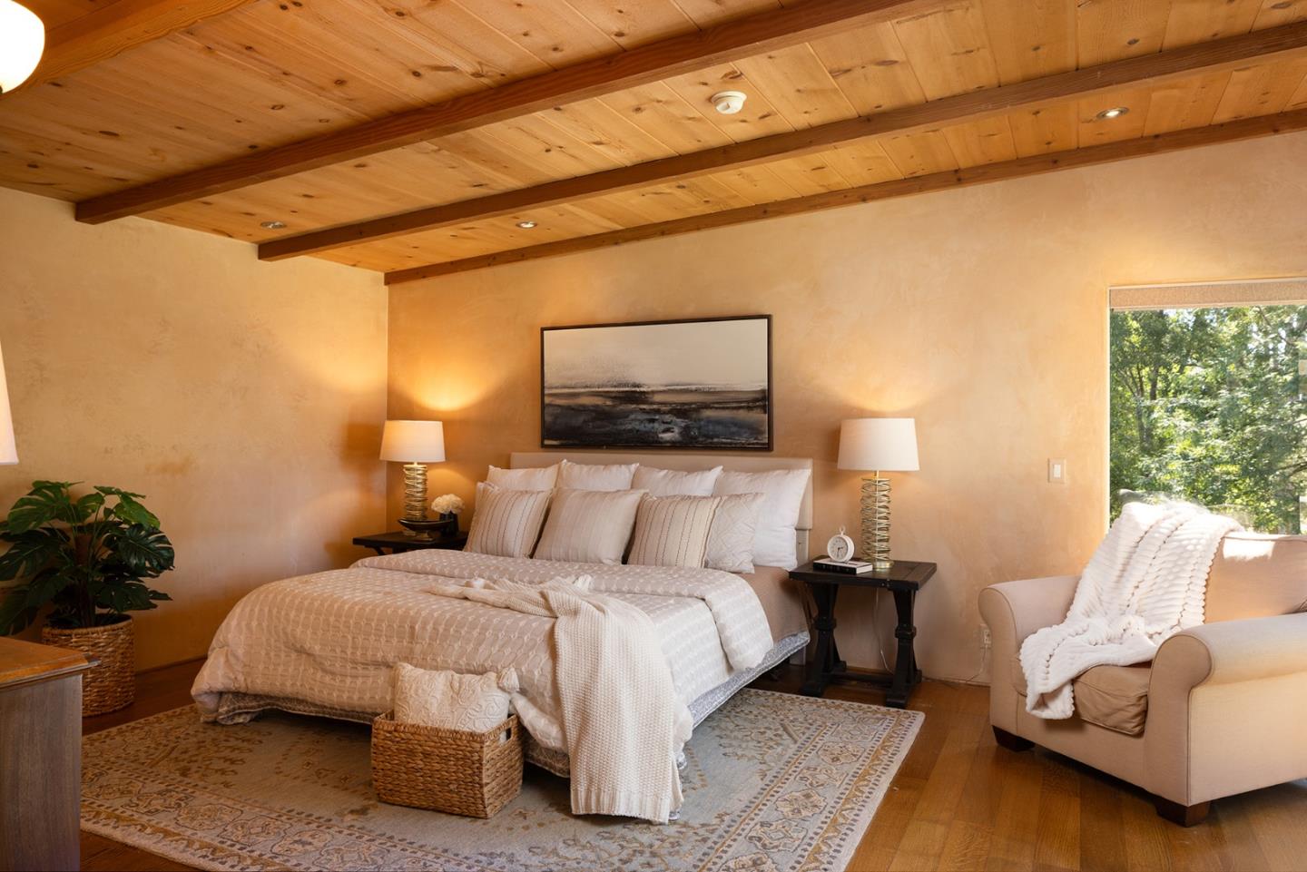 1318 Chamisal Way Pebble Beach, CA 93953 - Photo 12 of 24 a bedroom with a bed and a couch