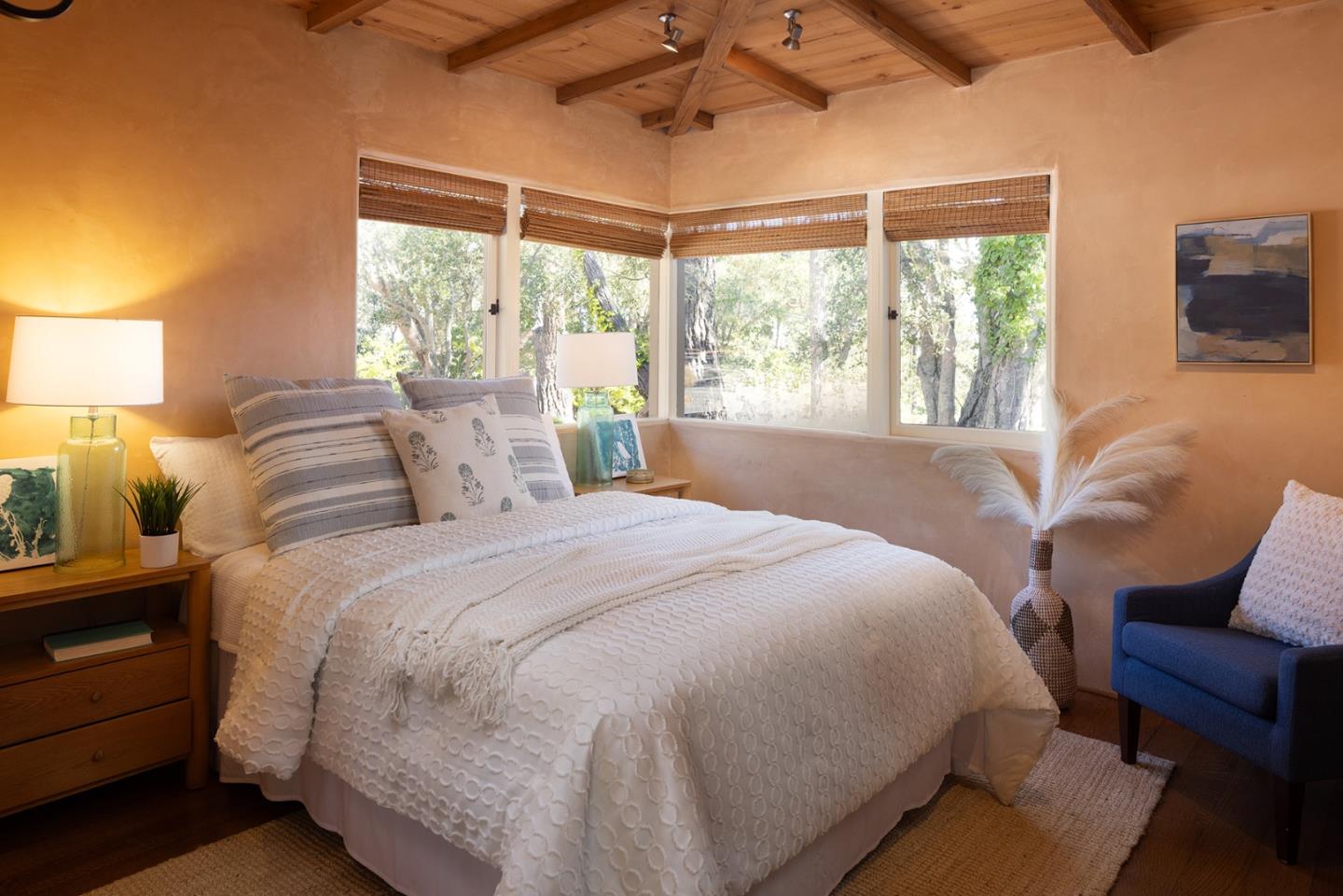 1318 Chamisal Way Pebble Beach, CA 93953 - Photo 15 of 24 a bedroom with a bed and a chair