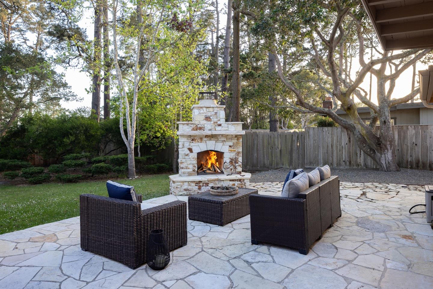 1318 Chamisal Way Pebble Beach, CA 93953 - Photo 19 of 24 a outdoor space with patio fireplace couches and a fire pit