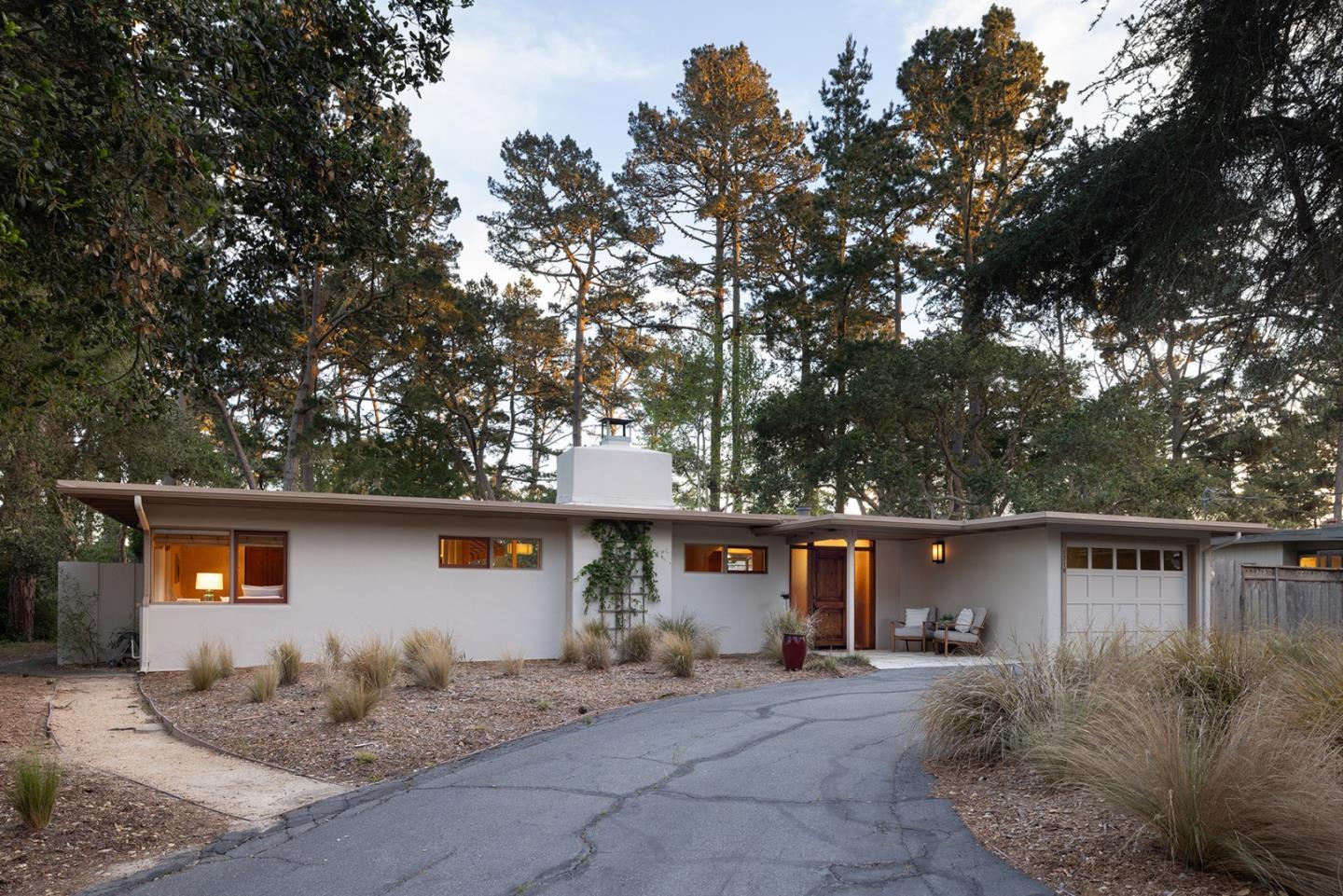 1318 Chamisal Way Pebble Beach, CA 93953 - Photo 3 of 24 front view of a house with a tree