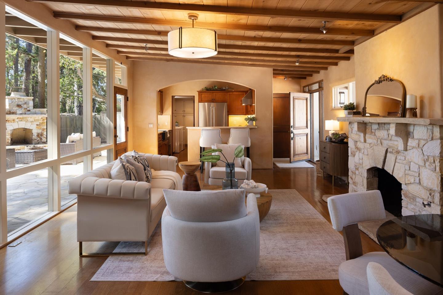 1318 Chamisal Way Pebble Beach, CA 93953 - Photo 7 of 24 a living room with furniture and a fireplace