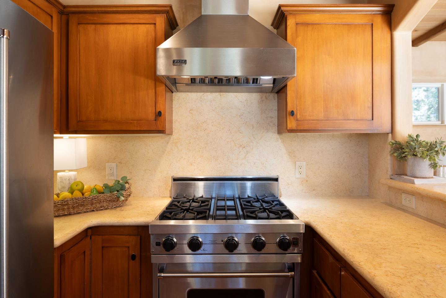 1318 Chamisal Way Pebble Beach, CA 93953 - Photo 9 of 24 a stove top oven sitting inside of a kitchen