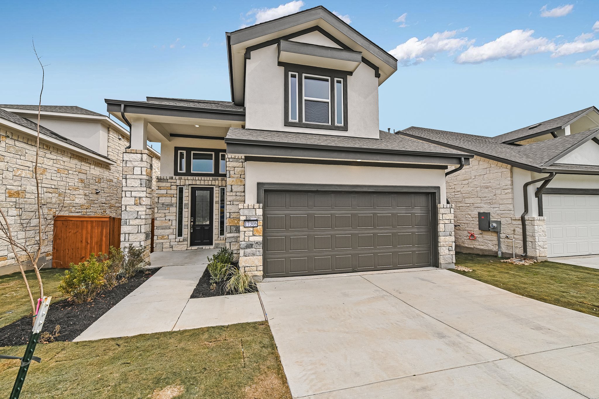 17306 Hattie Trace Austin, TX 78738 - Photo 1 of 37 a front view of a house with yard