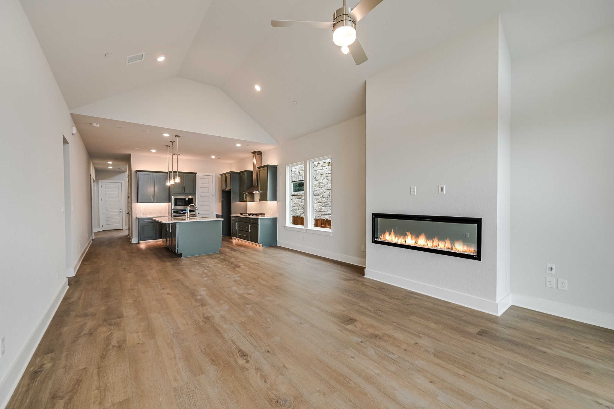 17306 Hattie Trace Austin, TX 78738 - Photo 11 of 37 a view of a kitchen with a sink and a fireplace
