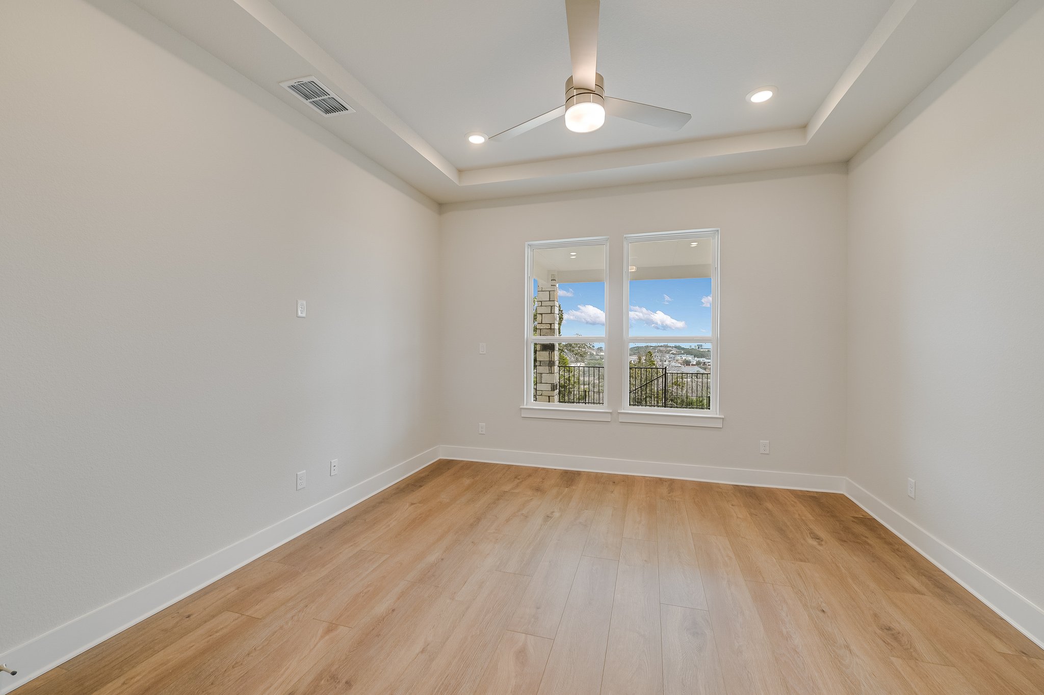 17306 Hattie Trace Austin, TX 78738 - Photo 13 of 37 an empty room with wooden floor and windows