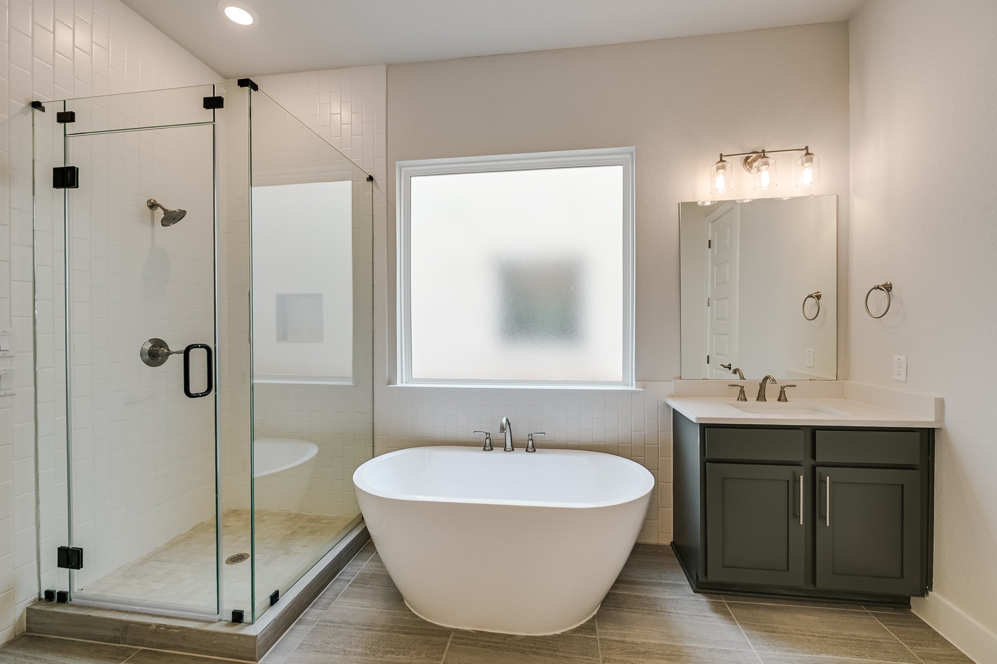 17306 Hattie Trace Austin, TX 78738 - Photo 14 of 37 a bathroom with a tub sink shower and mirror