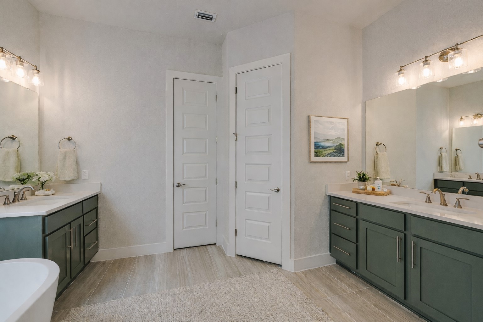 17306 Hattie Trace Austin, TX 78738 - Photo 15 of 37 a spacious bathroom with a double vanity sink and mirror