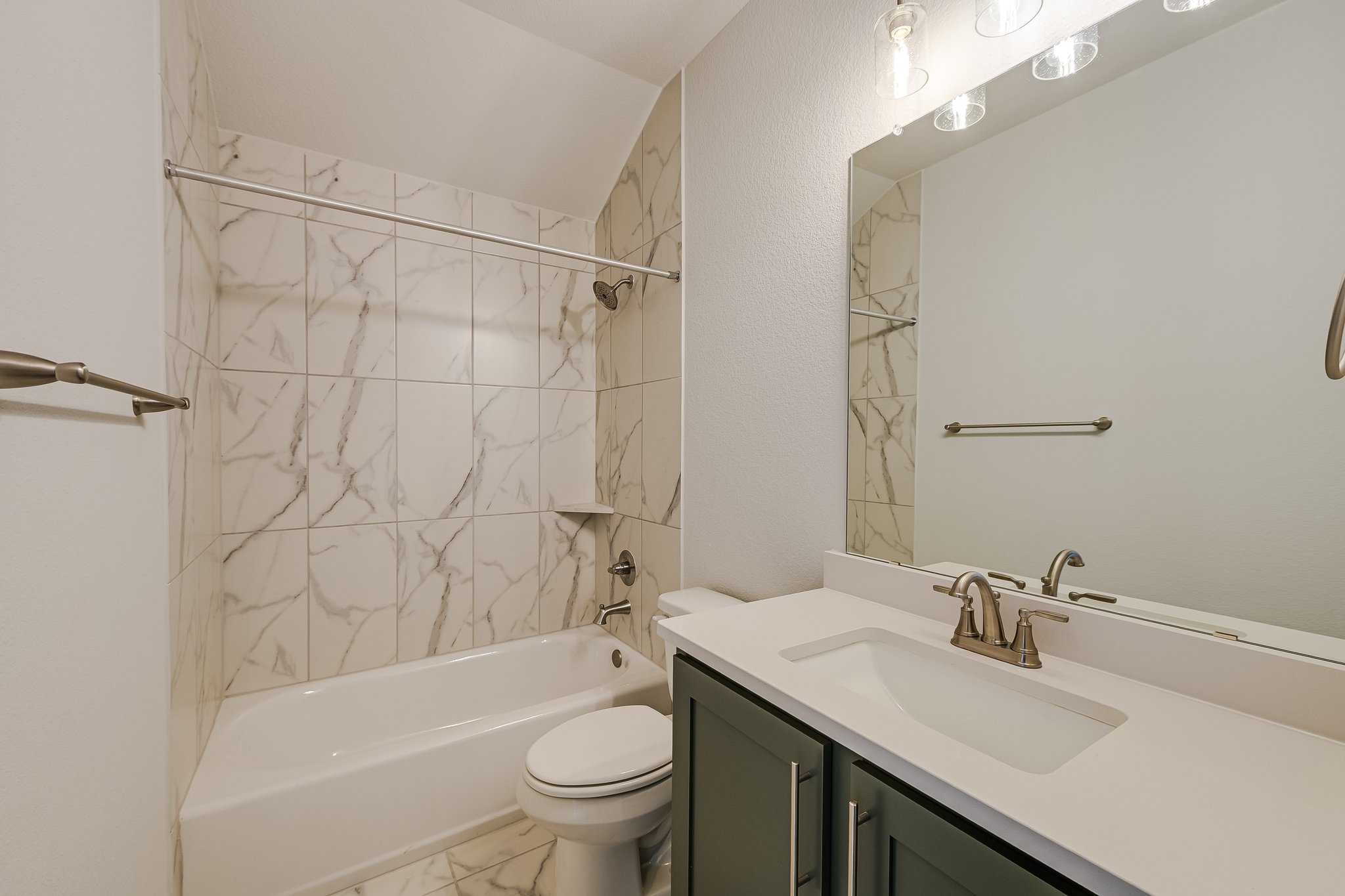 17306 Hattie Trace Austin, TX 78738 - Photo 19 of 37 a bathroom with a sink toilet vanity and shower