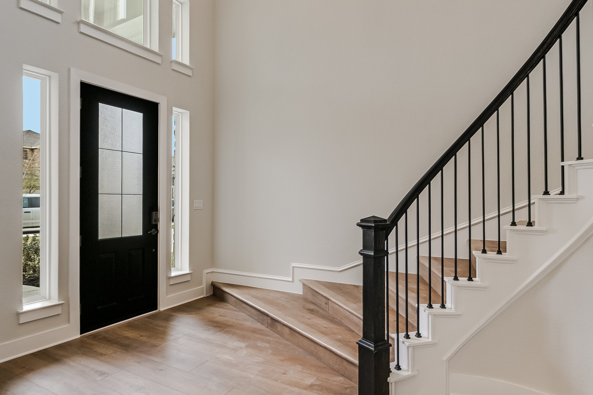 17306 Hattie Trace Austin, TX 78738 - Photo 2 of 37 a view of staircase with railing and white walls
