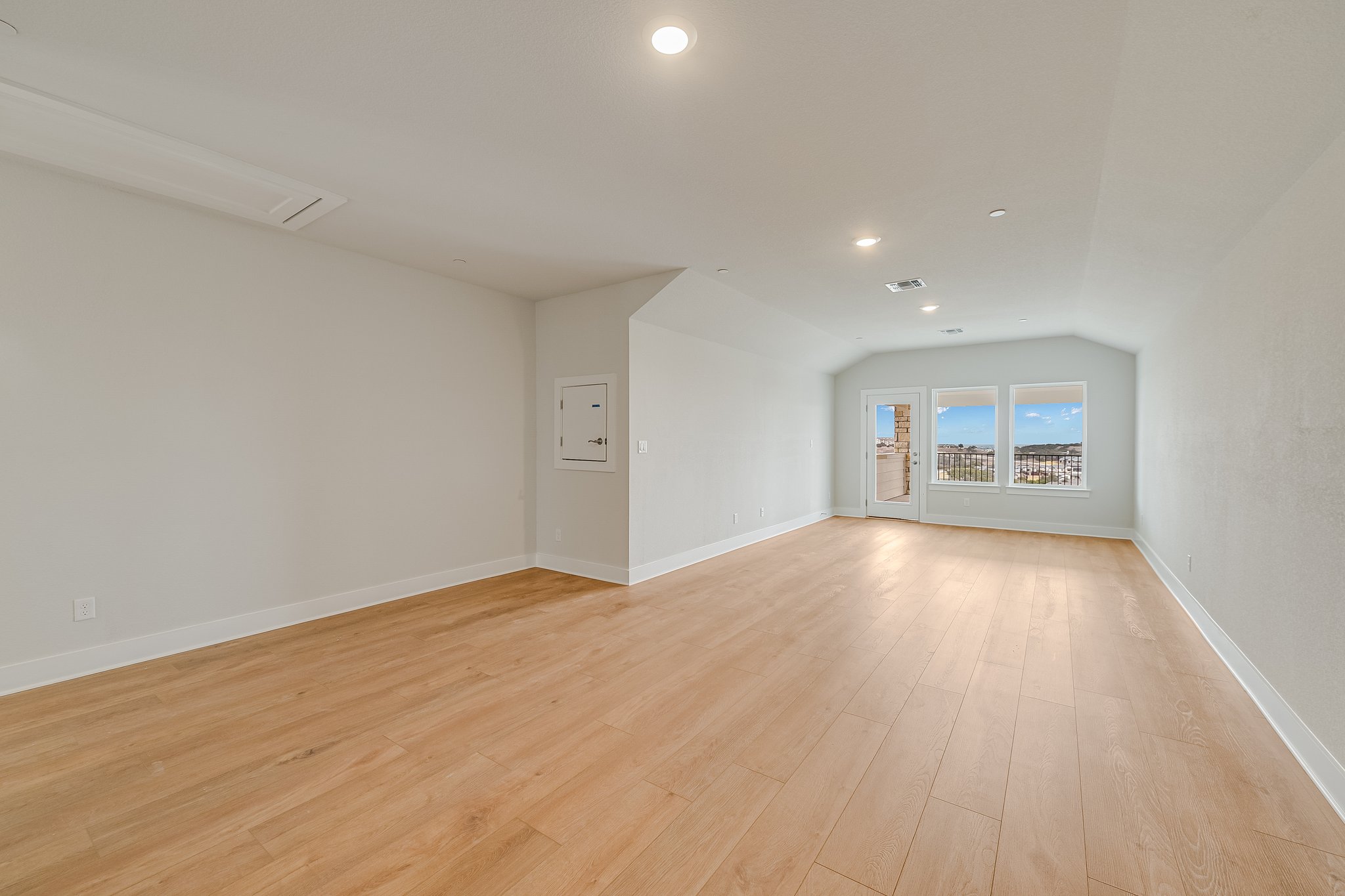 17306 Hattie Trace Austin, TX 78738 - Photo 26 of 37 a view of an empty room with a window and wooden floor