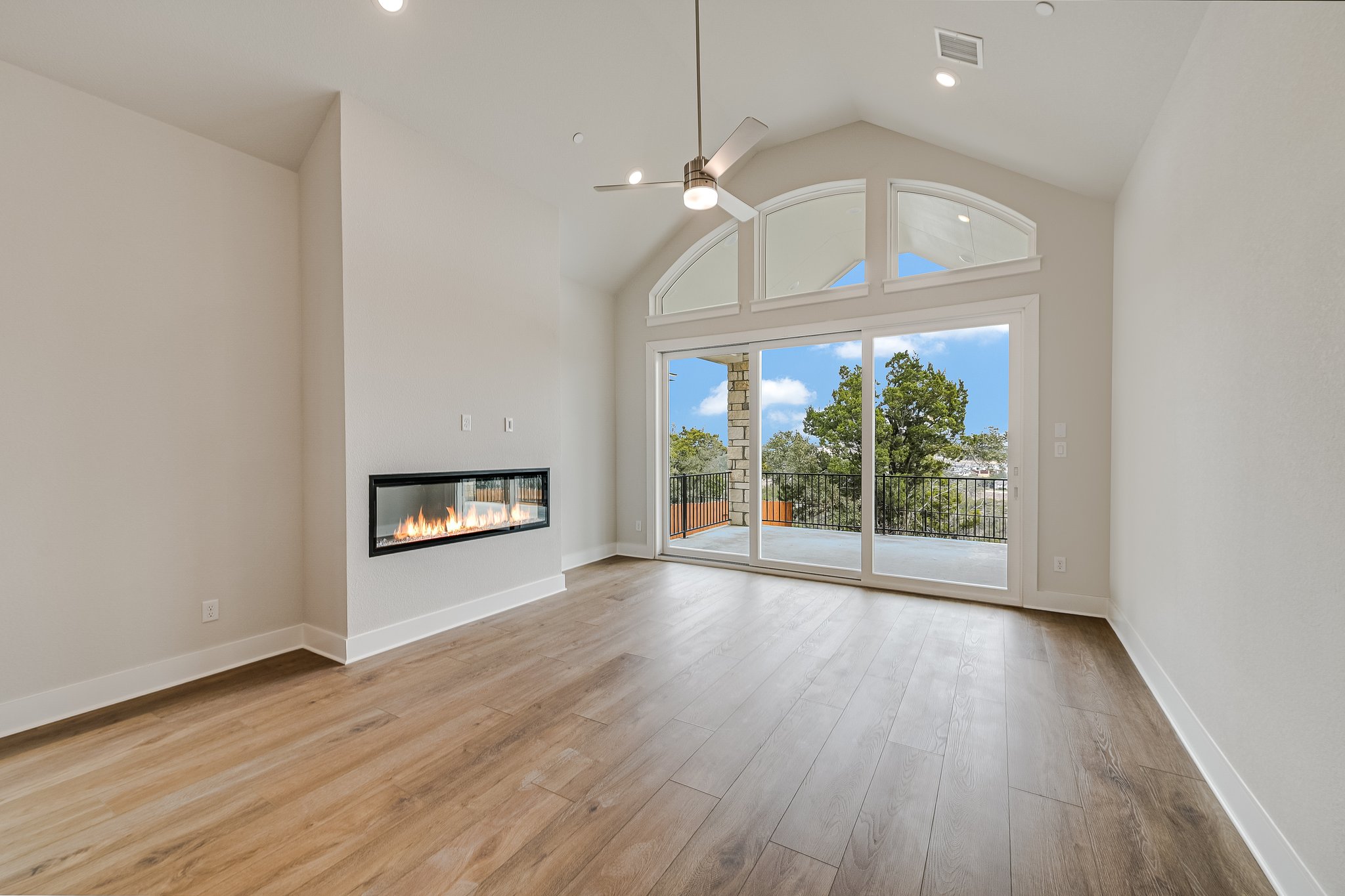 17306 Hattie Trace Austin, TX 78738 - Photo 10 of 37 a view of an empty room with a window and wooden floor