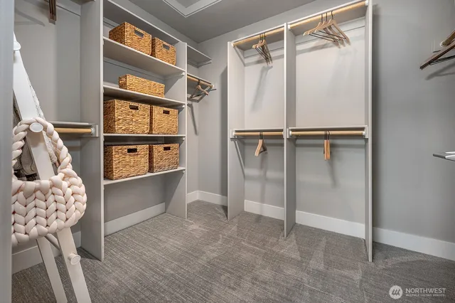 a view of walk in closet with empty racks