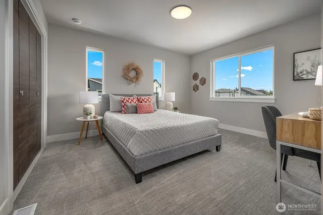 a bedroom with a bed and a lamp with window