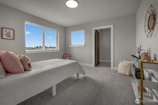 a bed room with a bed and a chair