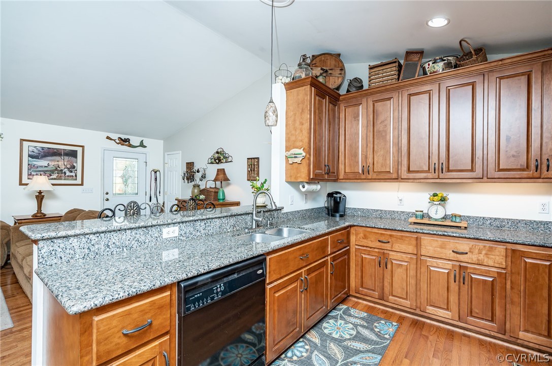 14490 Meade Road Amelia Court House, VA 23002 - Photo 11 of 25 a kitchen with stainless steel appliances granite countertop a sink dishwasher and cabinets with wooden floor