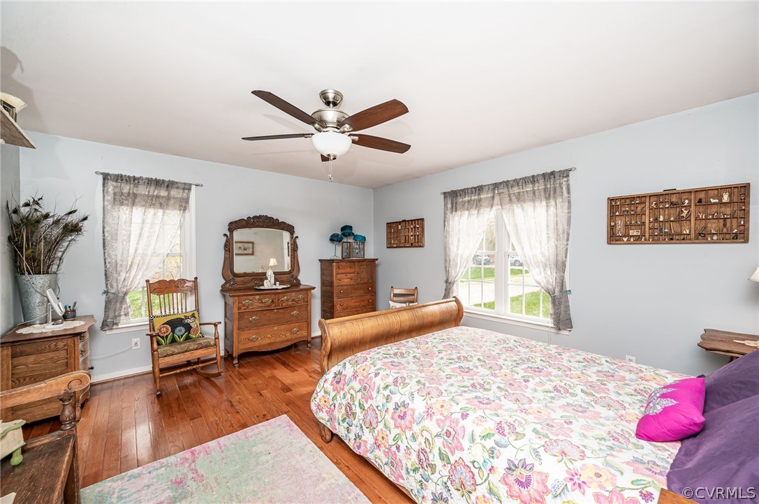 14490 Meade Road Amelia Court House, VA 23002 - Photo 14 of 25 a bedroom with a bed a large window and flat screen tv