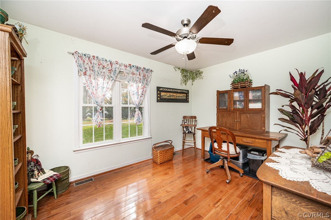 14490 Meade Road Amelia Court House, VA 23002 - Photo 18 of 25 a work room with furniture and wooden floor