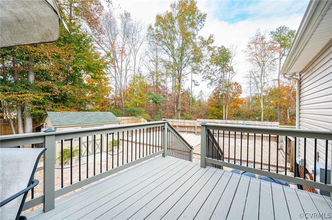 14490 Meade Road Amelia Court House, VA 23002 - Photo 21 of 25 a view of balcony with wooden floor and fence