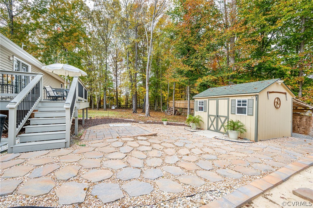 14490 Meade Road Amelia Court House, VA 23002 - Photo 22 of 25 a view of a house with backyard and trees
