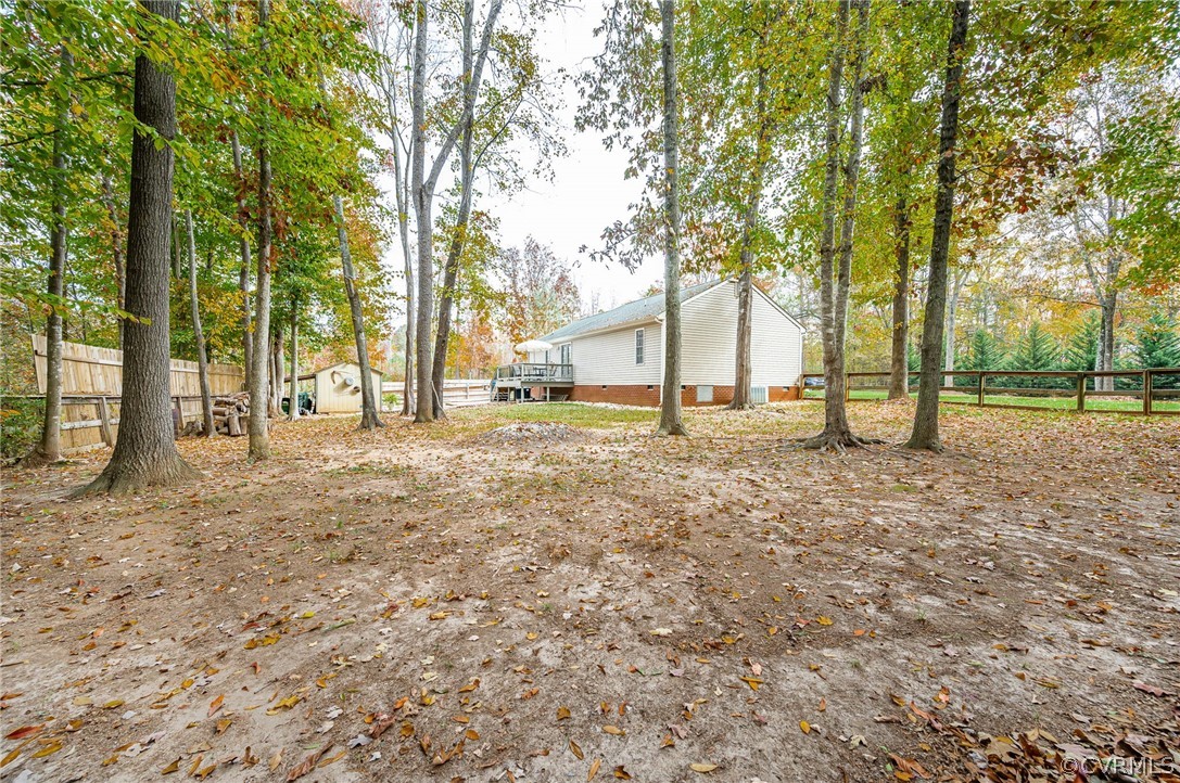 14490 Meade Road Amelia Court House, VA 23002 - Photo 24 of 25 a backyard of a house with lots of green space