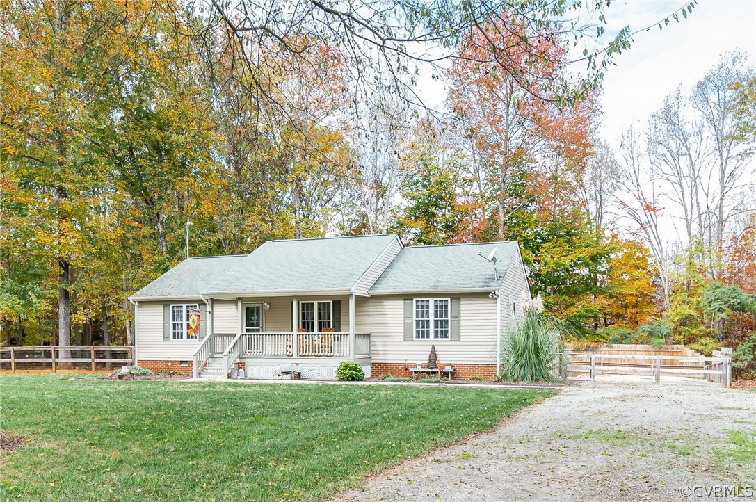 14490 Meade Road Amelia Court House, VA 23002 - Photo 3 of 25 a front view of a house with a garden and trees