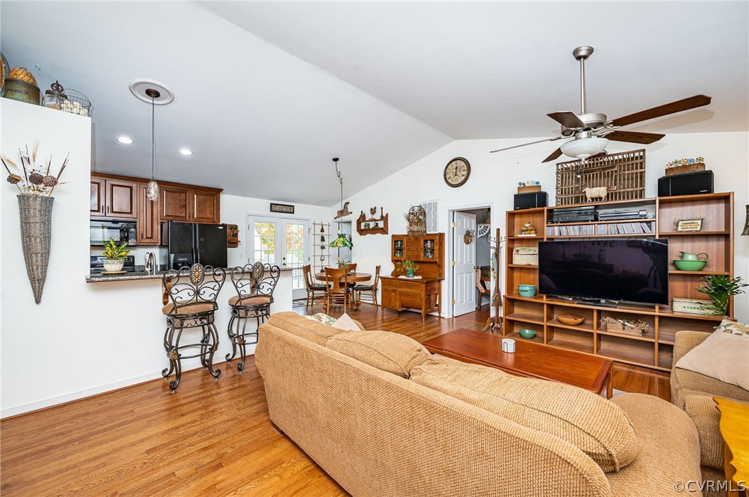 14490 Meade Road Amelia Court House, VA 23002 - Photo 6 of 25 a living room with furniture and a flat screen tv