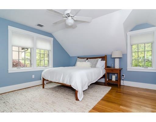 35 Bradford Road Wellesley, MA 02481 - Photo 15 of 26 a spacious bedroom with a bed a table and a dresser