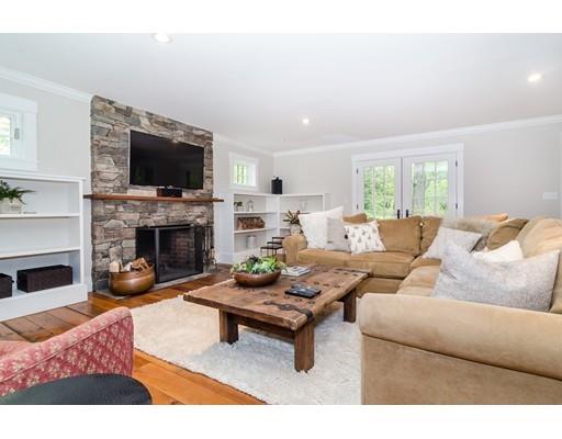35 Bradford Road Wellesley, MA 02481 - Photo 8 of 26 a living room with furniture a flat screen tv and a fireplace
