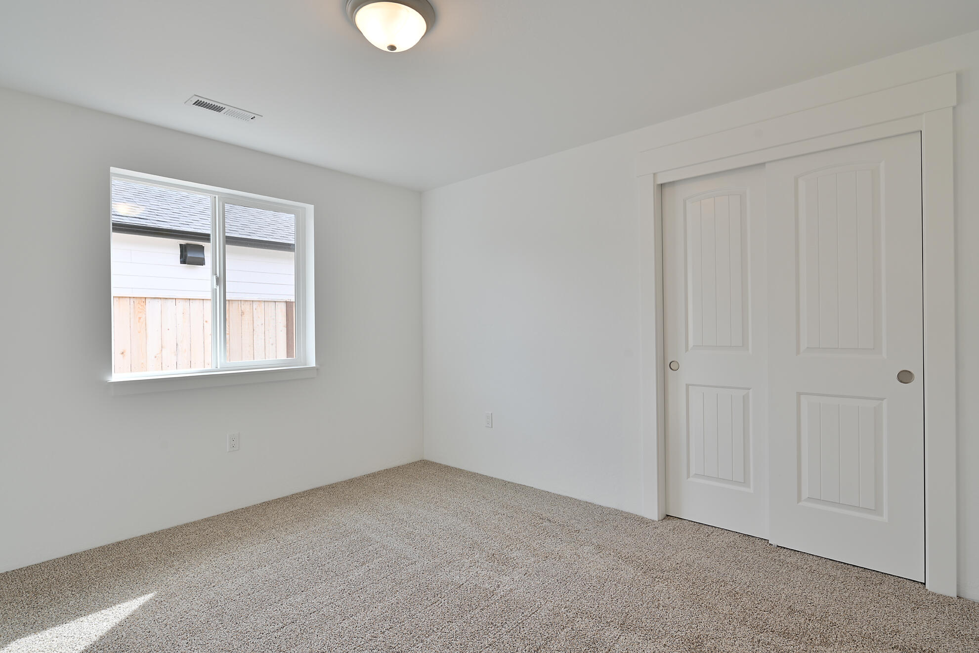 267 Samuel Lane Loop Road Phoenix, OR 97535 - Photo 9 of 16 a view of an empty room with a window and closet area