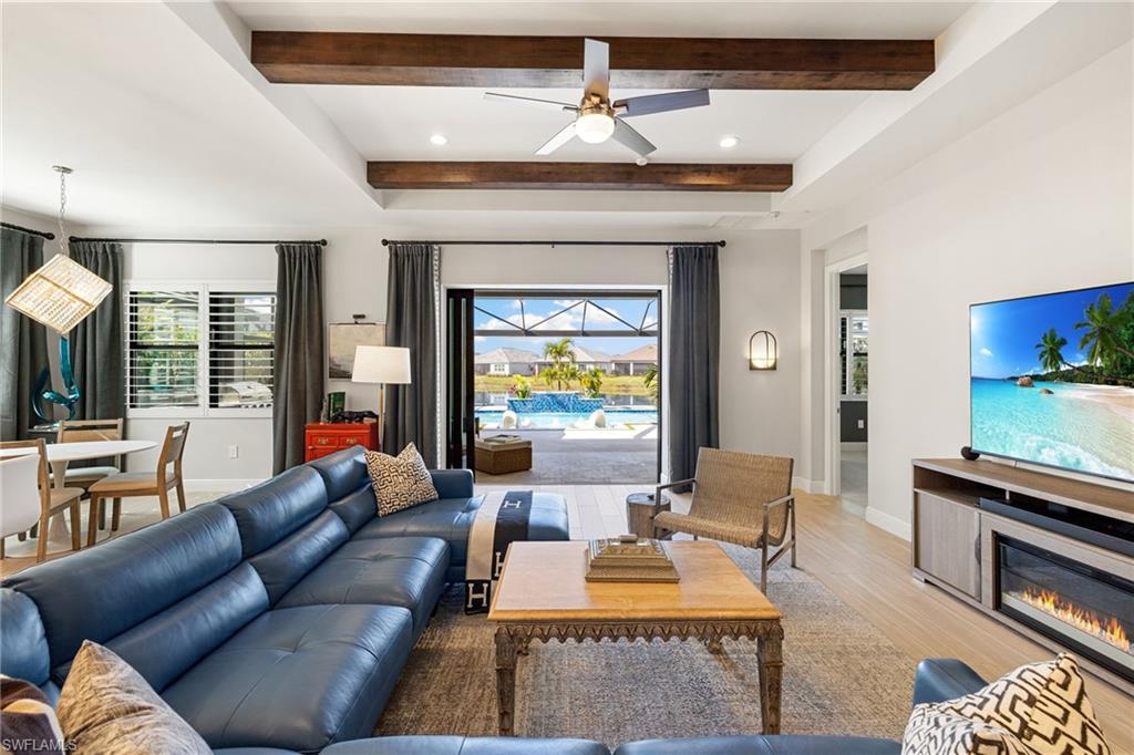 3967 Pegasus Way Naples, FL 34120 - Photo 3 of 50 a living room with furniture and a fireplace