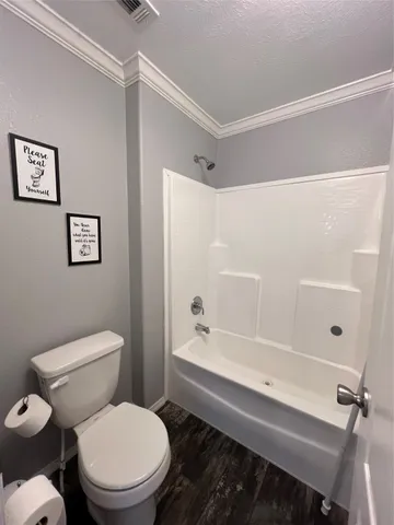 a bathroom with a toilet a sink and a bathtub