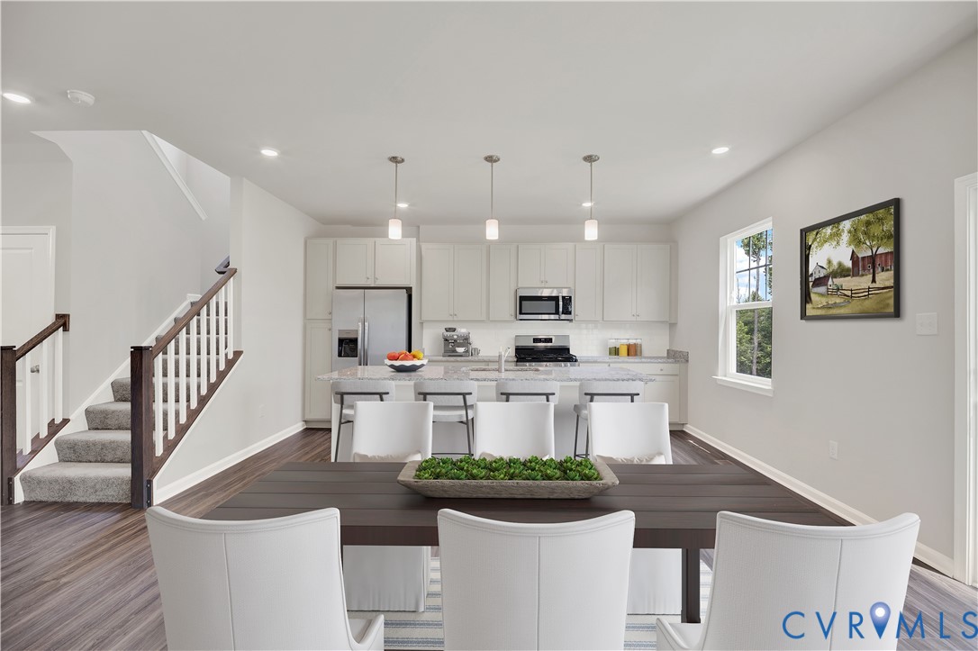 6454 Fennec Run Moseley, VA 23120 - Photo 3 of 23 a open kitchen with white cabinets and couches